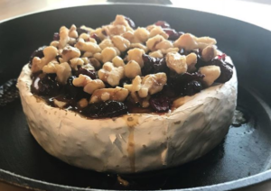 baked brie, dutch oven daddy, oven baked cheese, brie recipe, barrel aged maple syrup, bourbon syrup, smoked maple, maple syrup, cranberries, cheese recipe, appetizer, cast iron